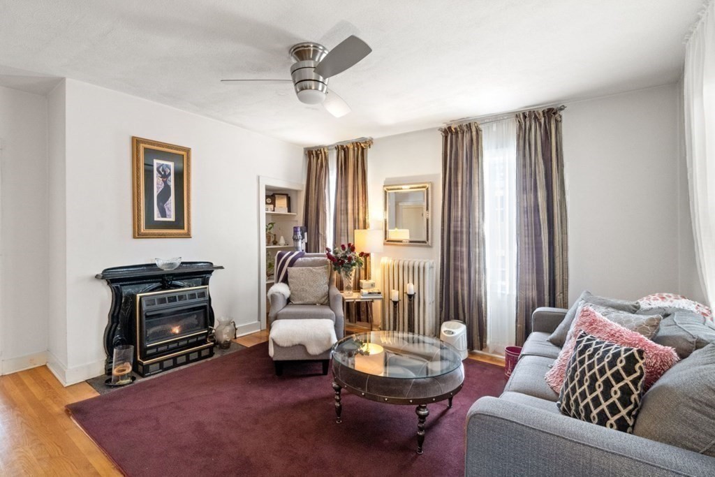 48 Cedar Street Boston, MA 02126 - Photo 14 of 32 a living room with furniture and a area