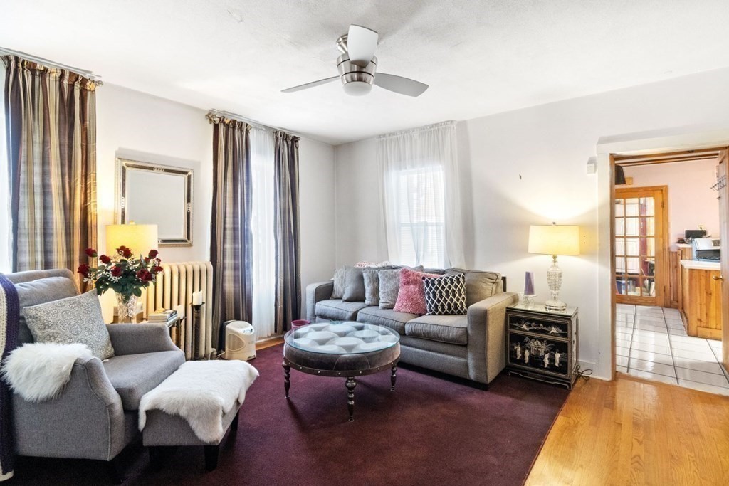 48 Cedar Street Boston, MA 02126 - Photo 15 of 32 a living room with furniture and a large window