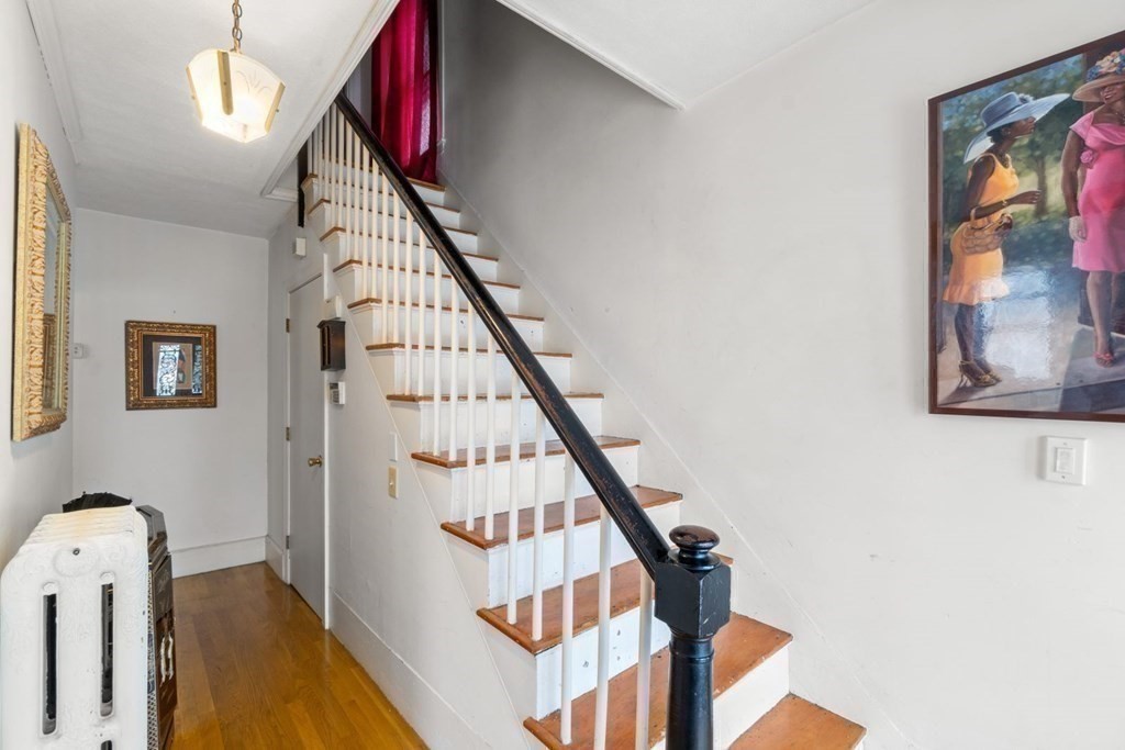 48 Cedar Street Boston, MA 02126 - Photo 18 of 32 a view of staircase with wooden floor and stairs