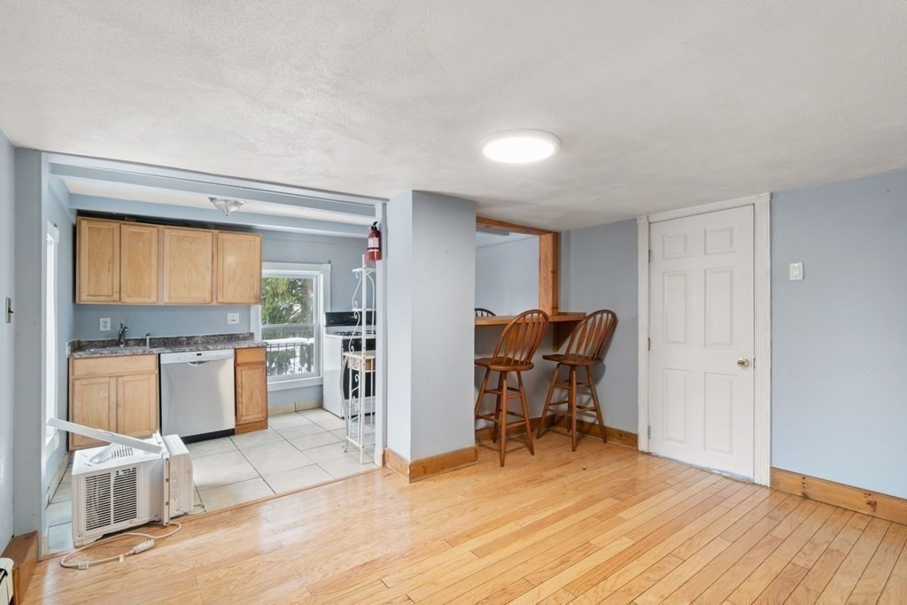 48 Cedar Street Boston, MA 02126 - Photo 27 of 32 a dining room with a couch and chairs