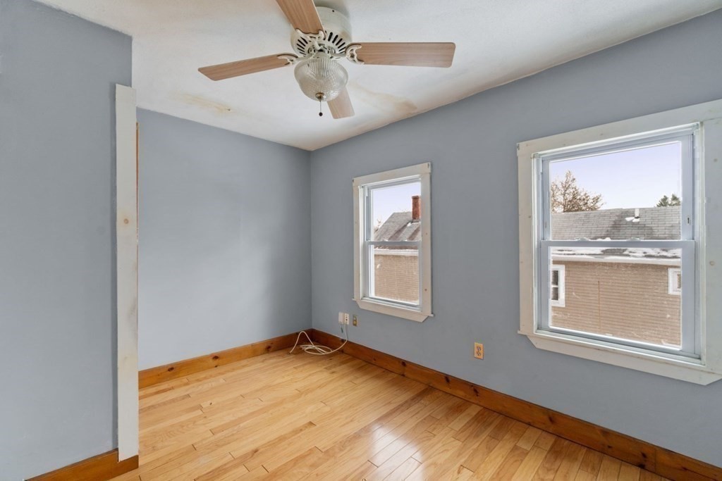 48 Cedar Street Boston, MA 02126 - Photo 30 of 32 a view of empty room with wooden floor and fan