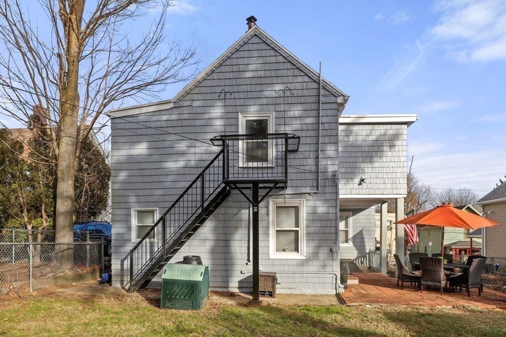48 Cedar Street Boston, MA 02126 - Photo 7 of 32 a front view of a house with chairs