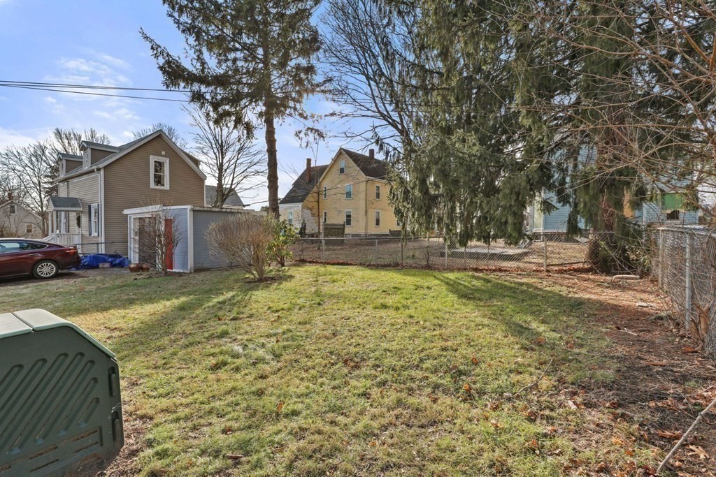 48 Cedar Street Boston, MA 02126 - Photo 9 of 32 a front view of a house with a yard covered with snow