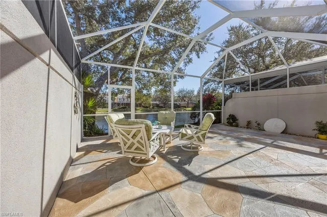 a view of a chairs and table in the patio