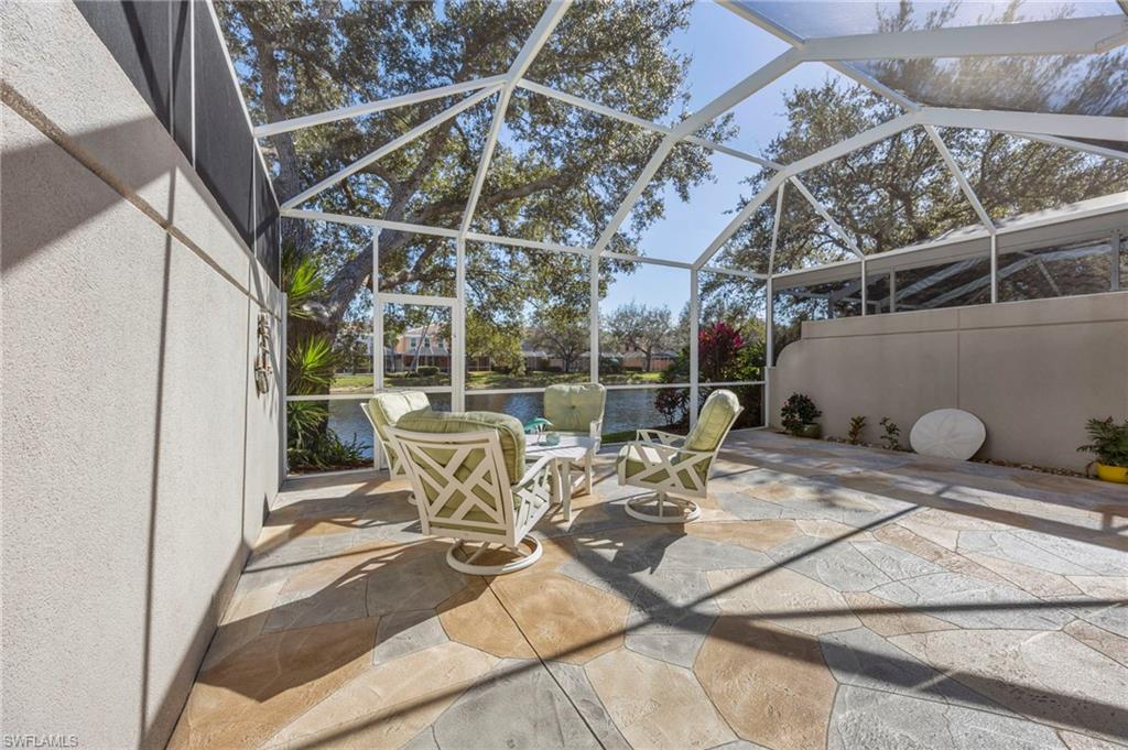 5561 Cove Circle Naples, FL 34119 - Photo 12 of 37 a view of a chairs and table in the patio