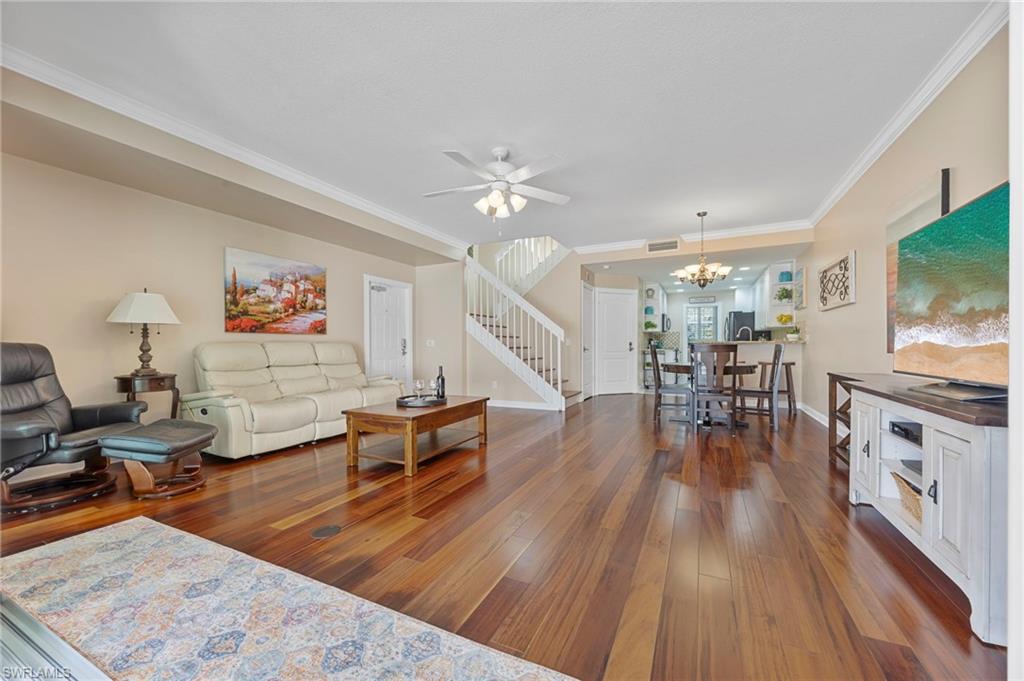 5561 Cove Circle Naples, FL 34119 - Photo 15 of 37 a living room with furniture and a flat screen tv