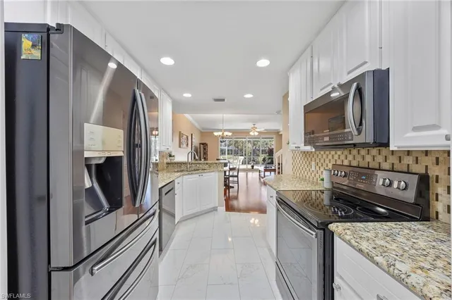 a kitchen with a sink microwave and refrigerator