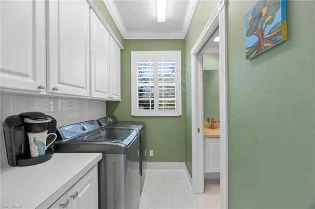 a kitchen with a sink cabinets and a window
