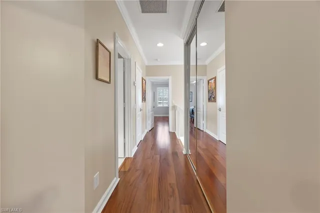 a view of hallway with wooden floor