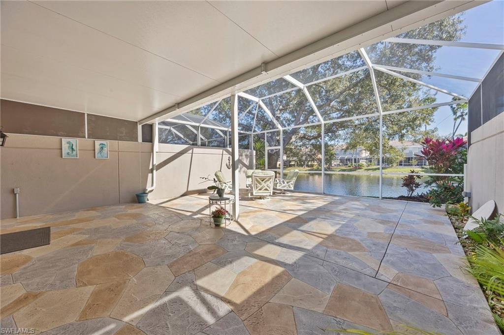 5561 Cove Circle Naples, FL 34119 - Photo 4 of 37 a view of an empty room with a garage