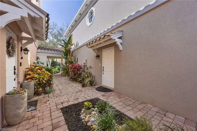 a view of a house with a potted plant