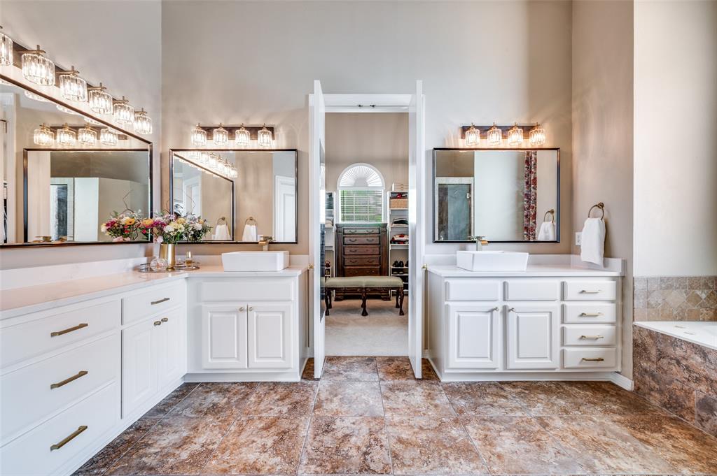2841 Winding Creek Road Prosper, TX 75078 - Photo 20 of 40 a spacious bathroom with a double vanity sink and a mirror