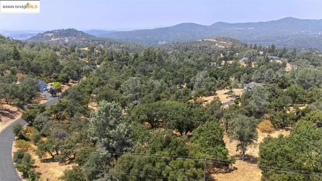 a view of a town with mountains in the background