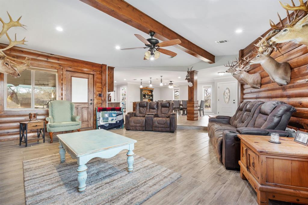 1407 Withers Road Mineral Wells, TX 76067 - Photo 16 of 38 a living room with furniture and a wooden floor