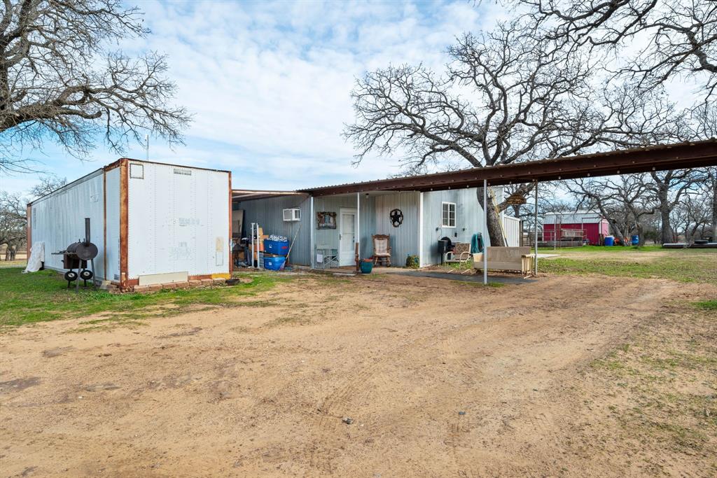1407 Withers Road Mineral Wells, TX 76067 - Photo 28 of 38 a view of outdoor space with deck and tree