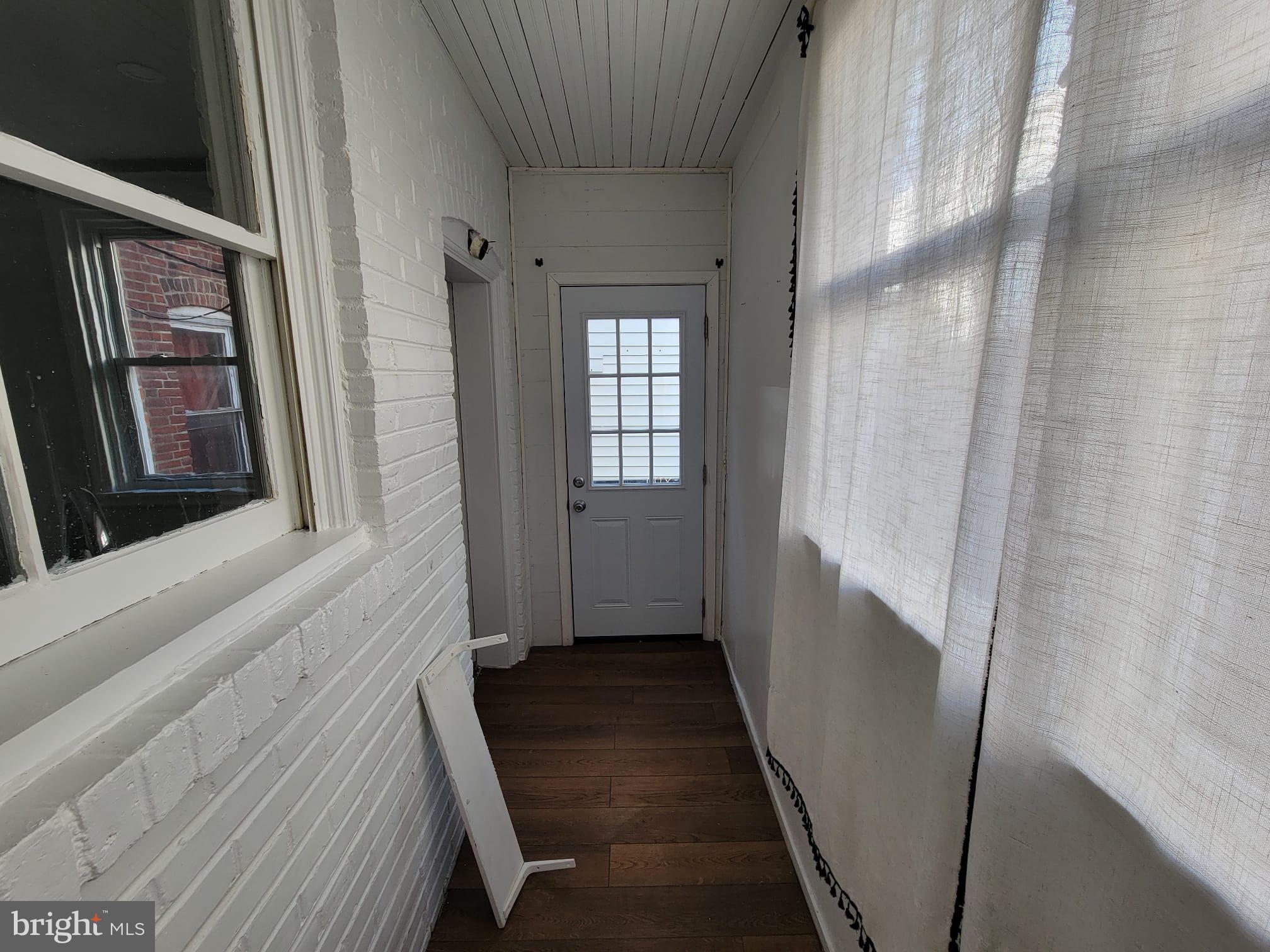 7243 Calvin Road Upper Darby, PA 19082 - Photo 13 of 29 a hallway with wooden floor and stairs