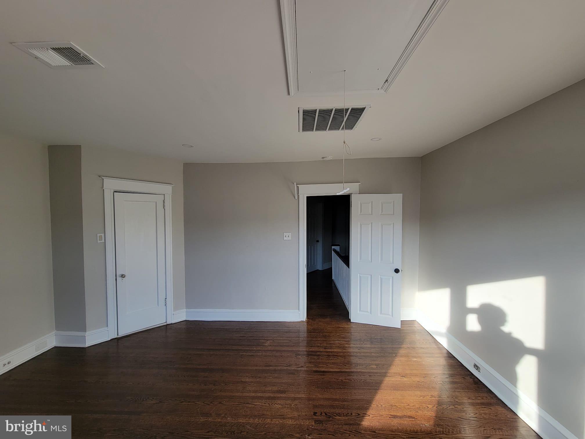 7243 Calvin Road Upper Darby, PA 19082 - Photo 19 of 29 a view of an empty room with wooden floor