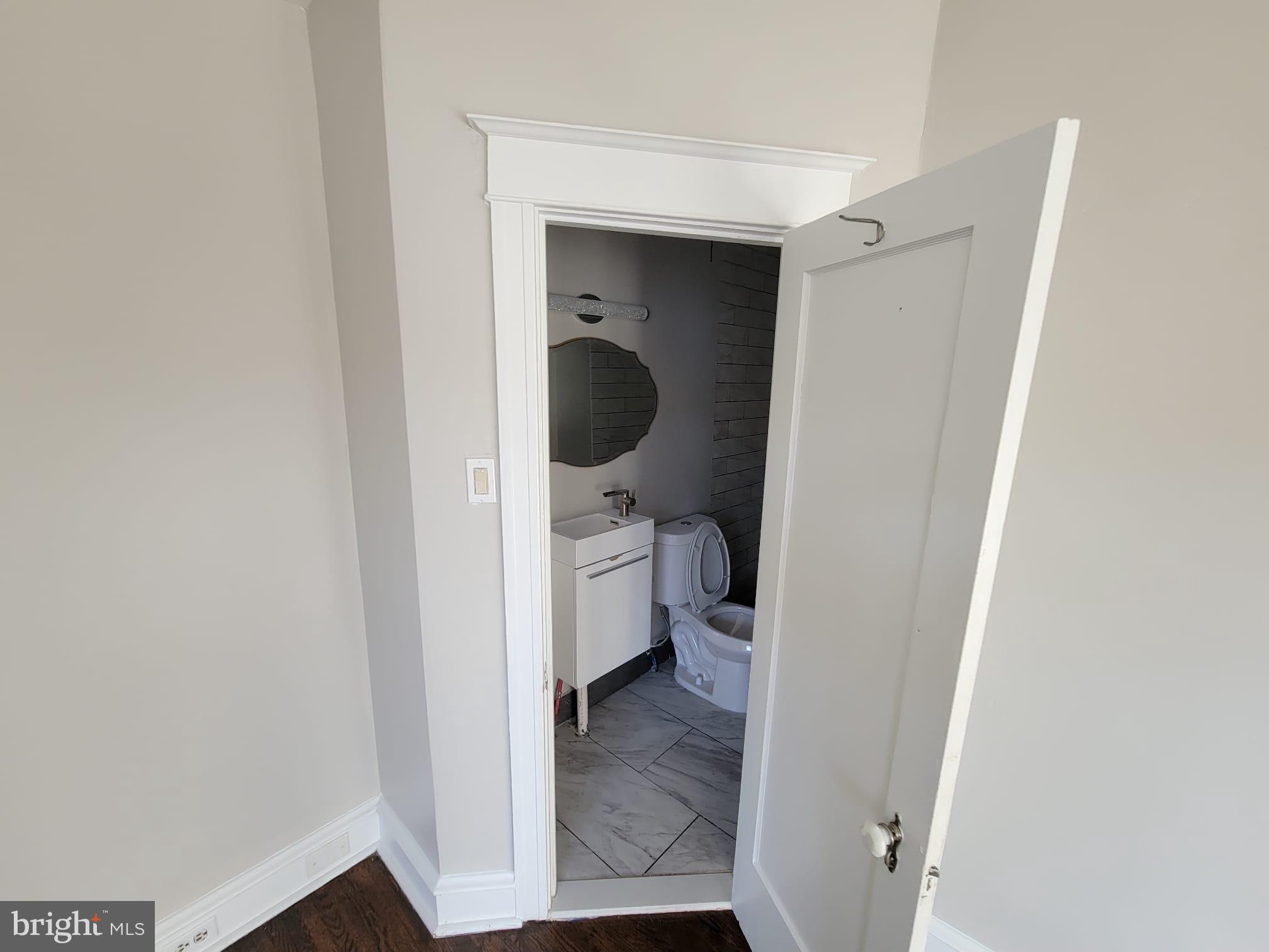 7243 Calvin Road Upper Darby, PA 19082 - Photo 21 of 29 a view of a bathroom from a hallway