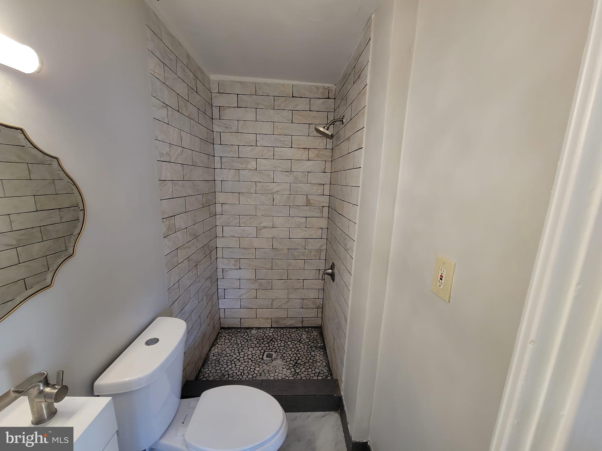 7243 Calvin Road Upper Darby, PA 19082 - Photo 23 of 29 a bathroom with a toilet and a shower