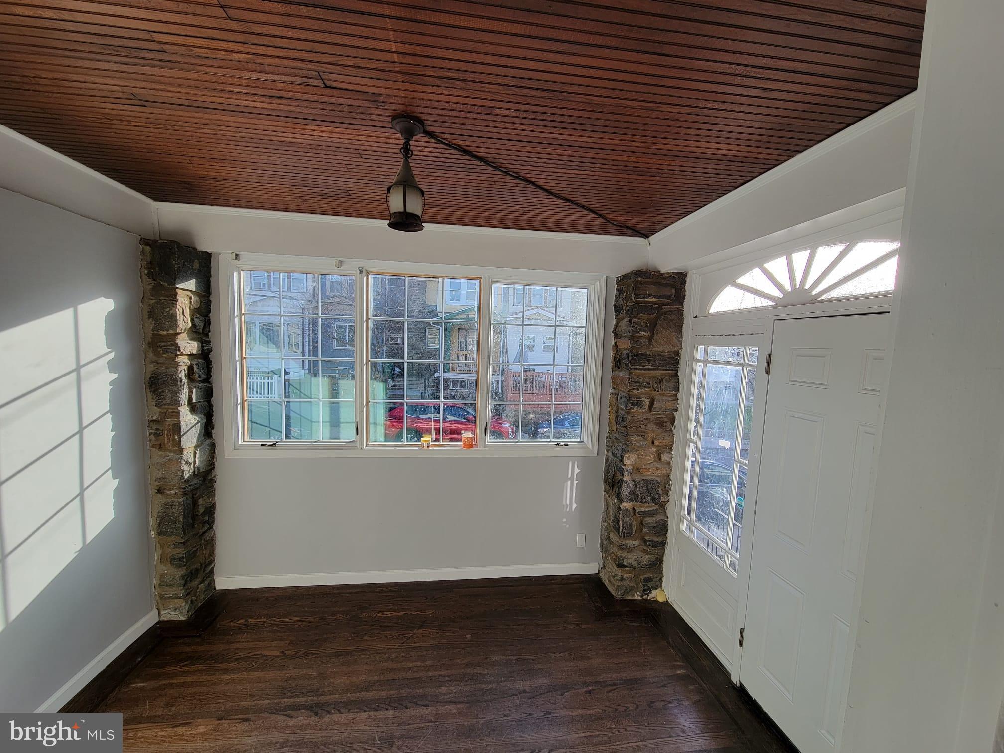7243 Calvin Road Upper Darby, PA 19082 - Photo 3 of 29 wooden floor in an empty room with a window