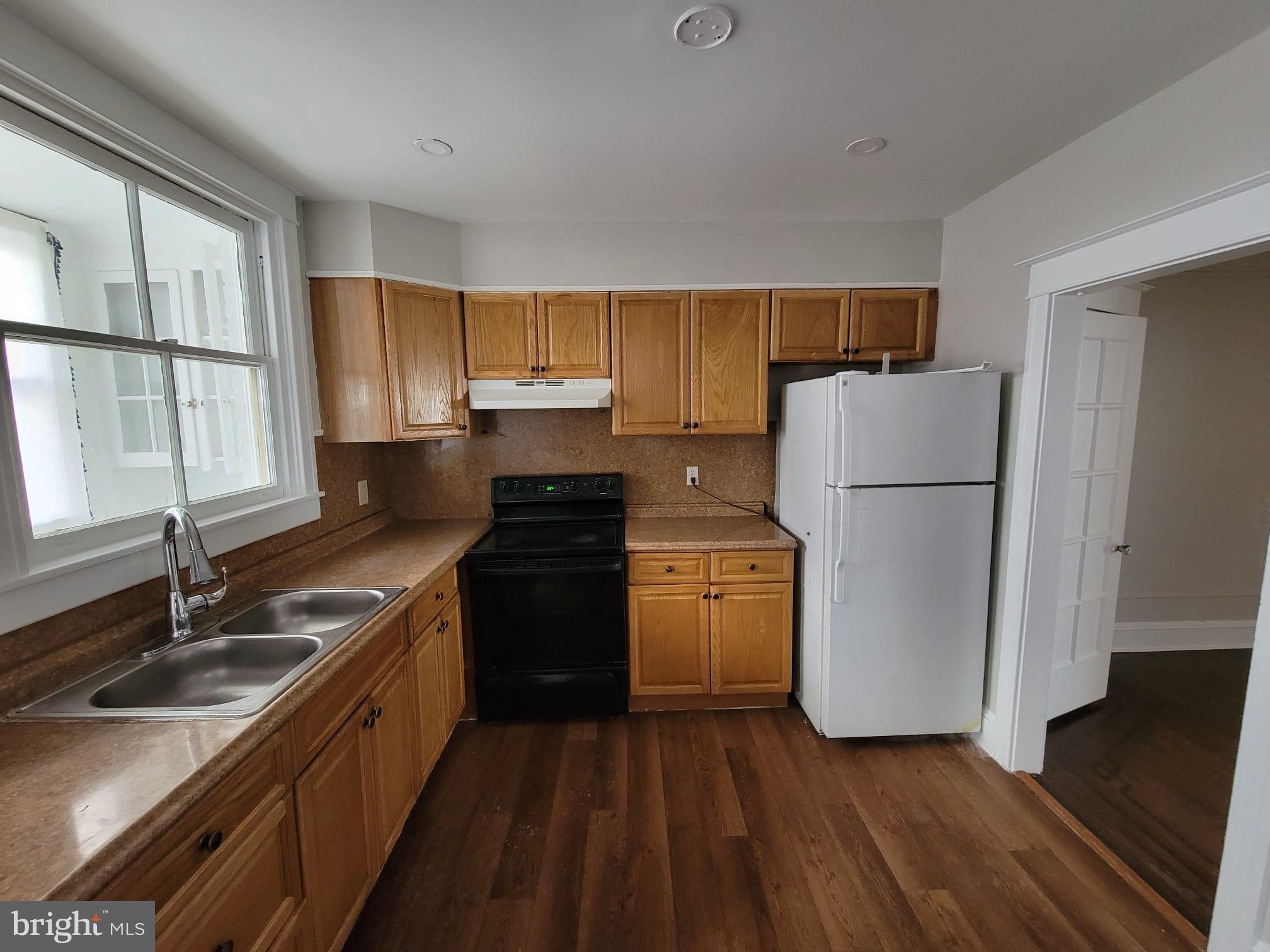 7243 Calvin Road Upper Darby, PA 19082 - Photo 10 of 29 a kitchen with a refrigerator sink and stove