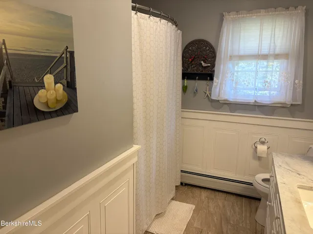 a view of a livingroom with furniture and white walls