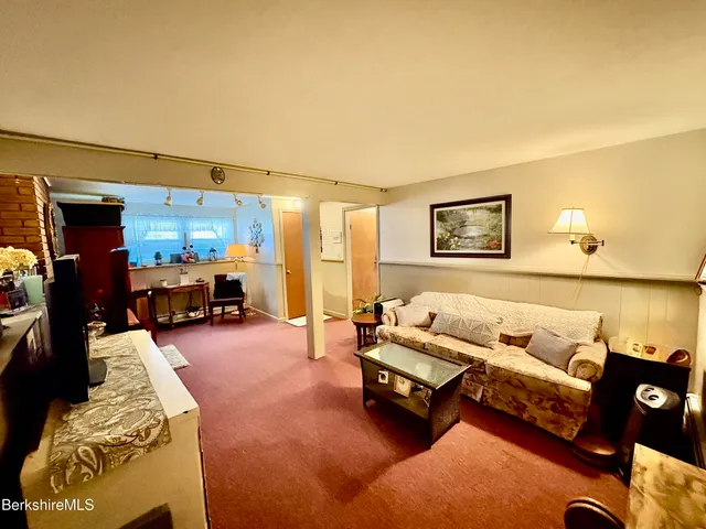 a view of workspace with furniture and window