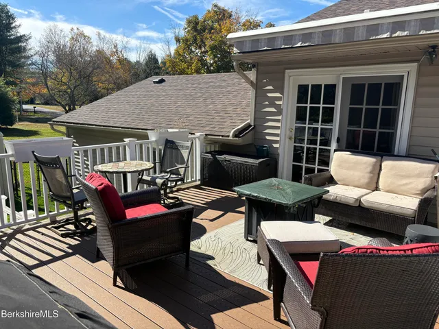a house view with a sitting space and garden space