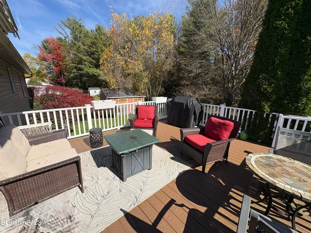 a view of a house in a big yard with large trees