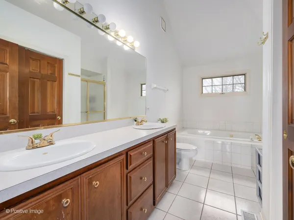 a bathroom with a sink a vanity and a mirror