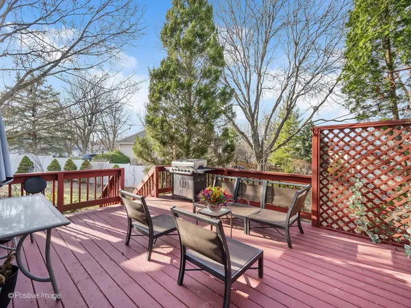 a view of chairs on wooden deck