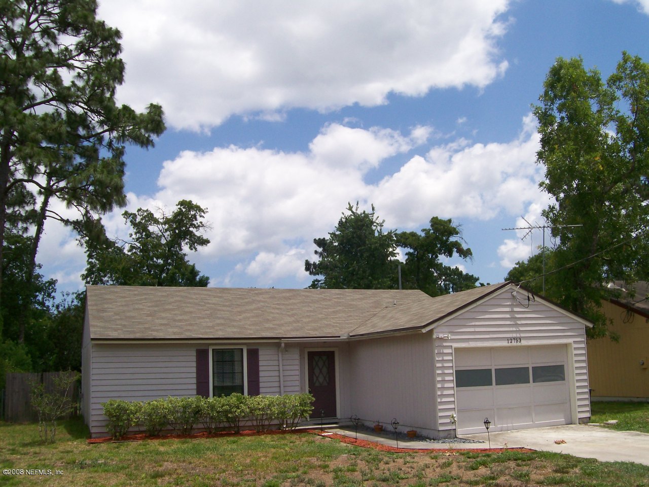 12753 Beaubien Road Jacksonville, FL 32258 - Photo 1 of 14 front view of a house with a yard