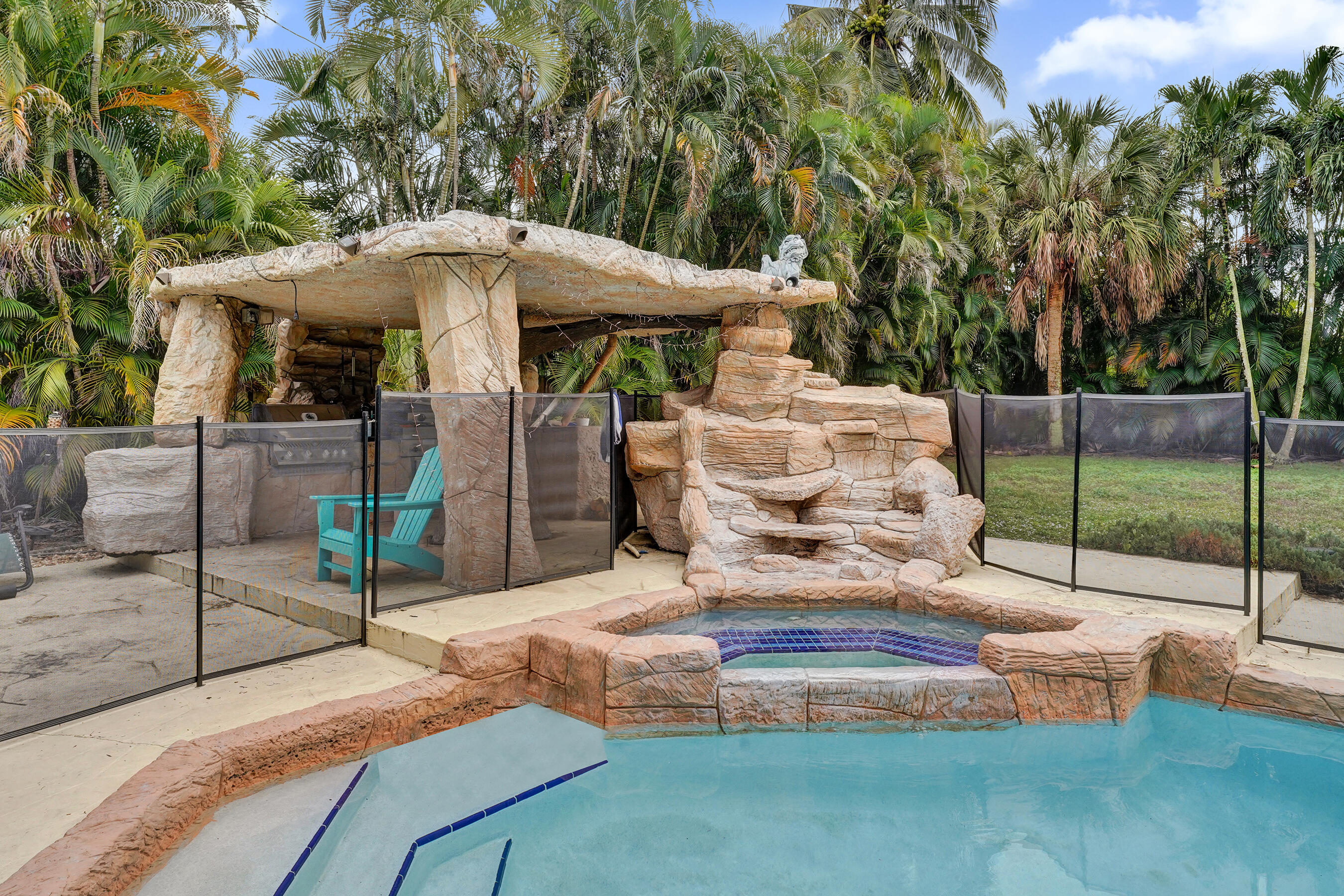5612 Harding Street Hollywood, FL 33021 - Photo 12 of 52 a view of a patio with table and chairs potted plants with wooden fence