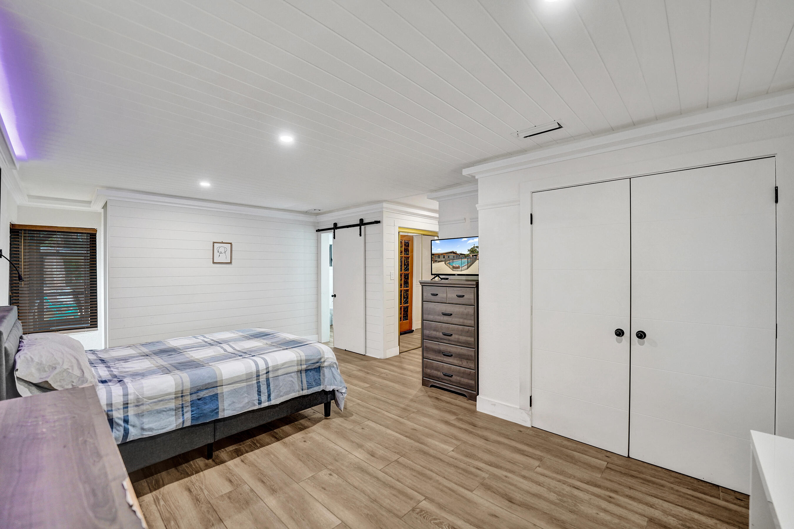 5612 Harding Street Hollywood, FL 33021 - Photo 25 of 52 a bedroom with bed and closet