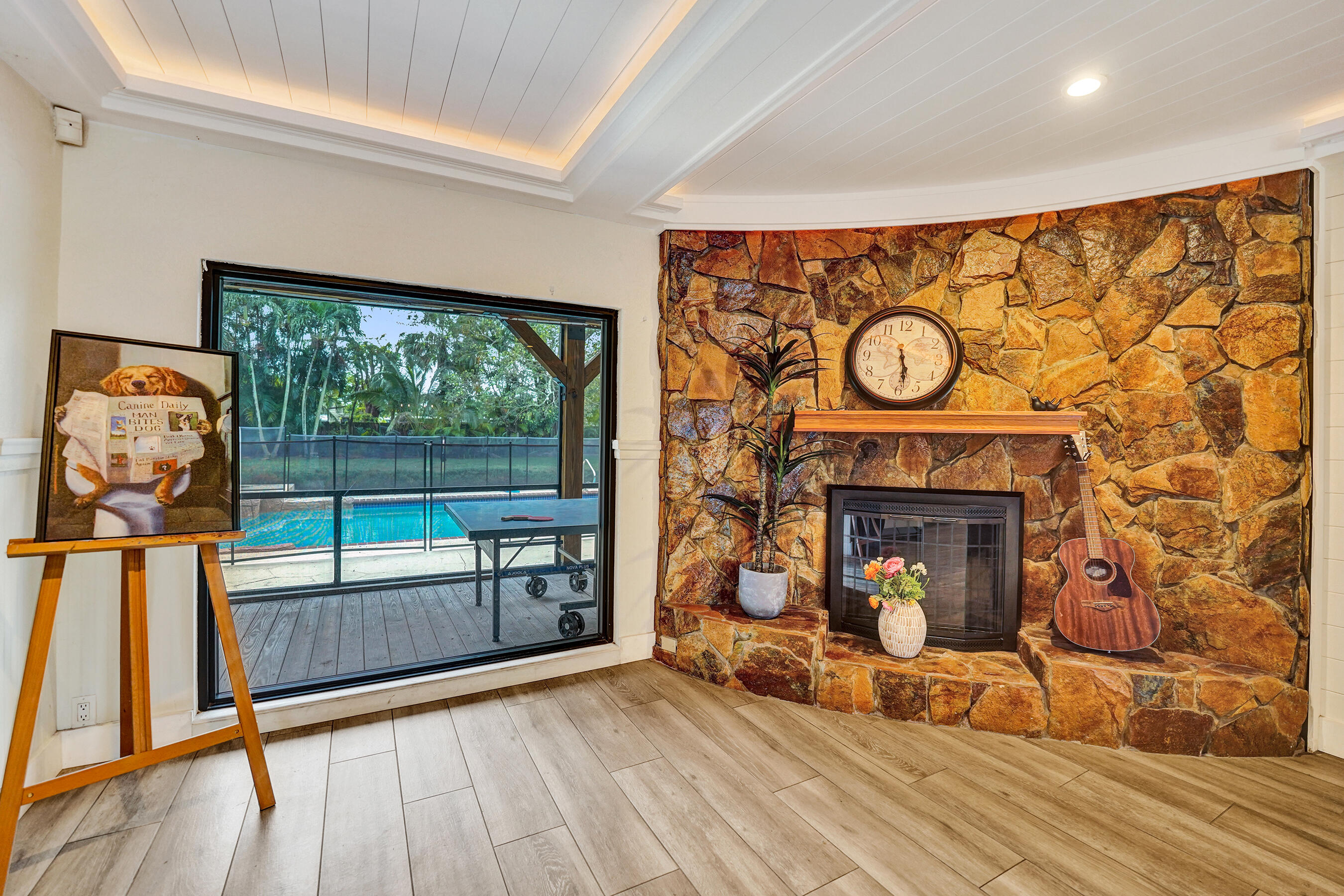 5612 Harding Street Hollywood, FL 33021 - Photo 32 of 52 a view of a fireplace with wooden floor