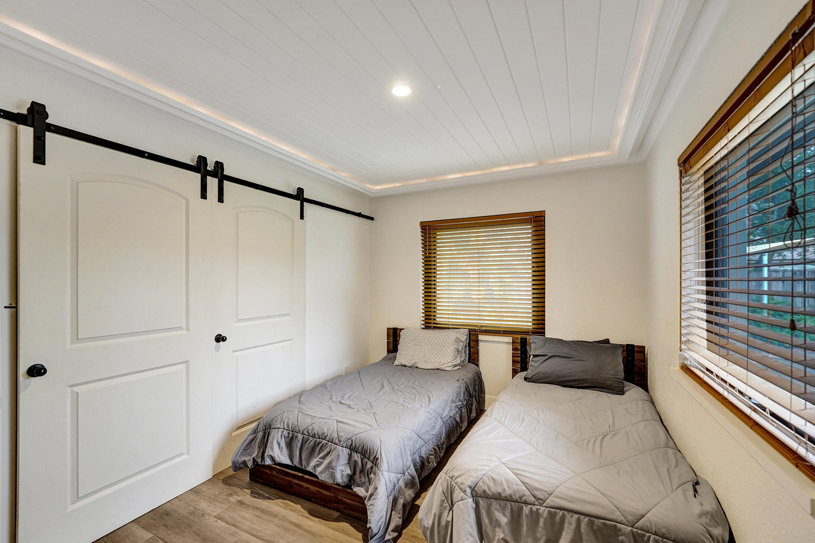 5612 Harding Street Hollywood, FL 33021 - Photo 36 of 52 a bedroom with a bed and a window