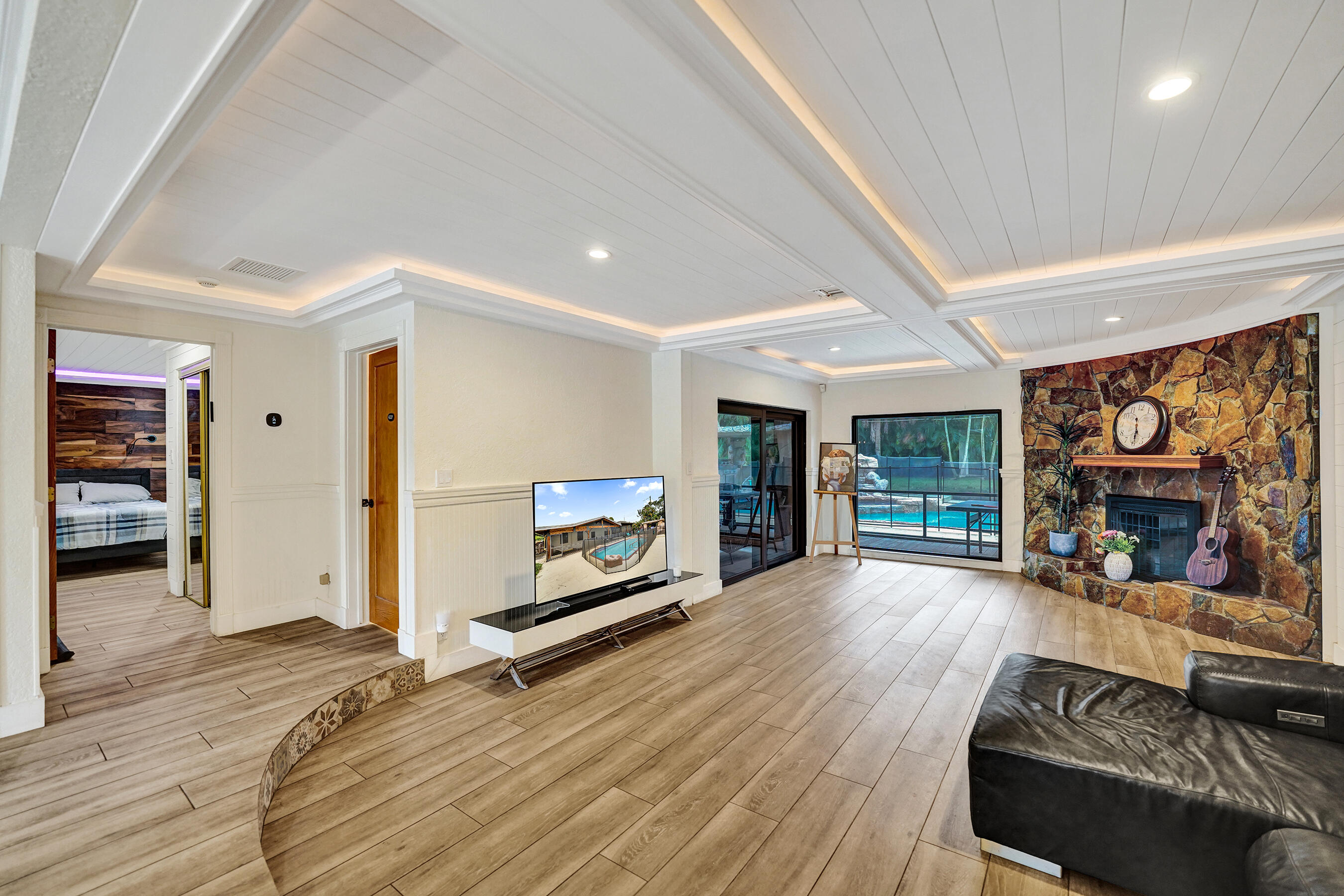 5612 Harding Street Hollywood, FL 33021 - Photo 40 of 52 a living room with furniture and a fireplace
