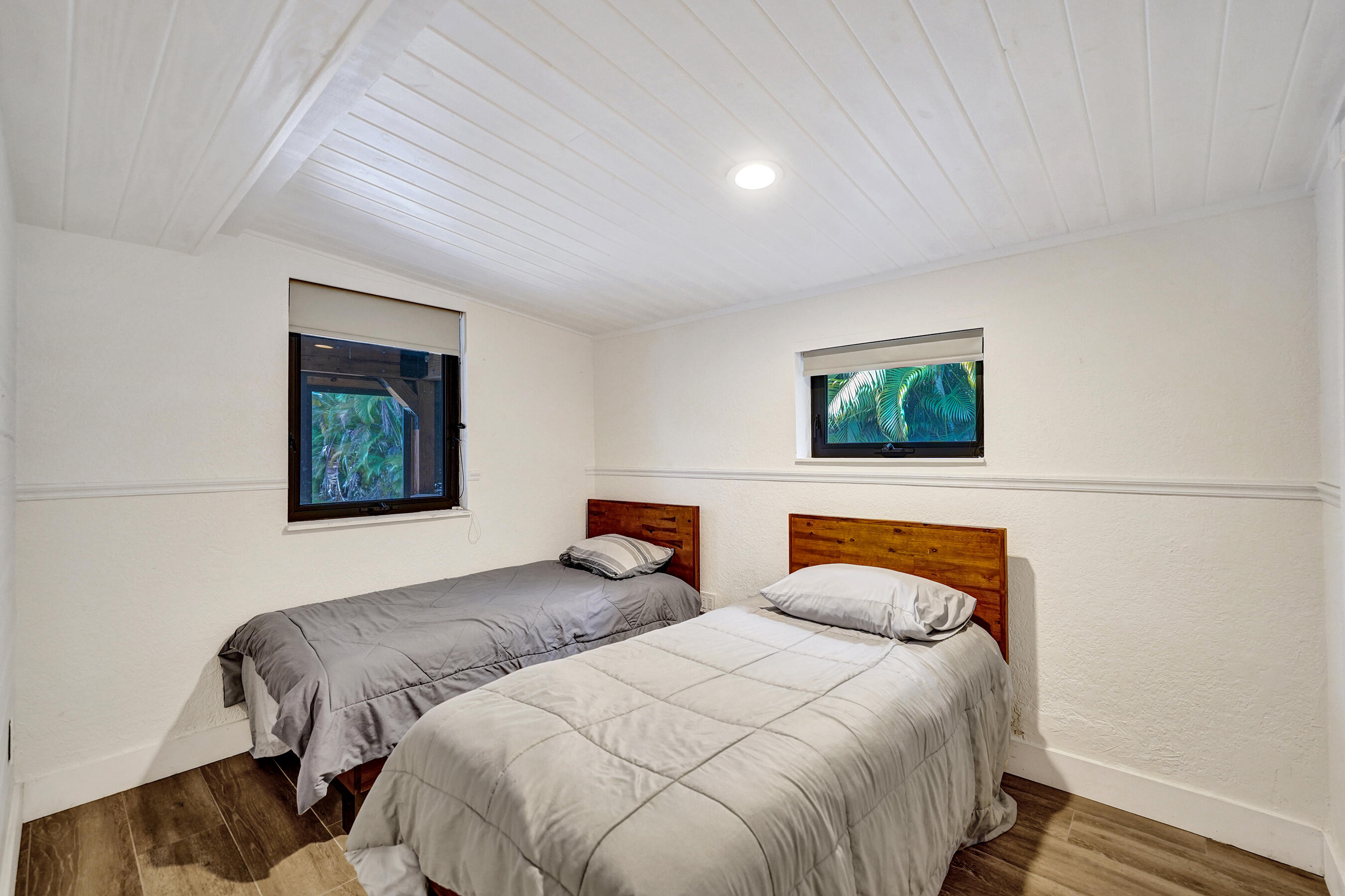 5612 Harding Street Hollywood, FL 33021 - Photo 41 of 52 a bedroom with two beds and a painting on the wall