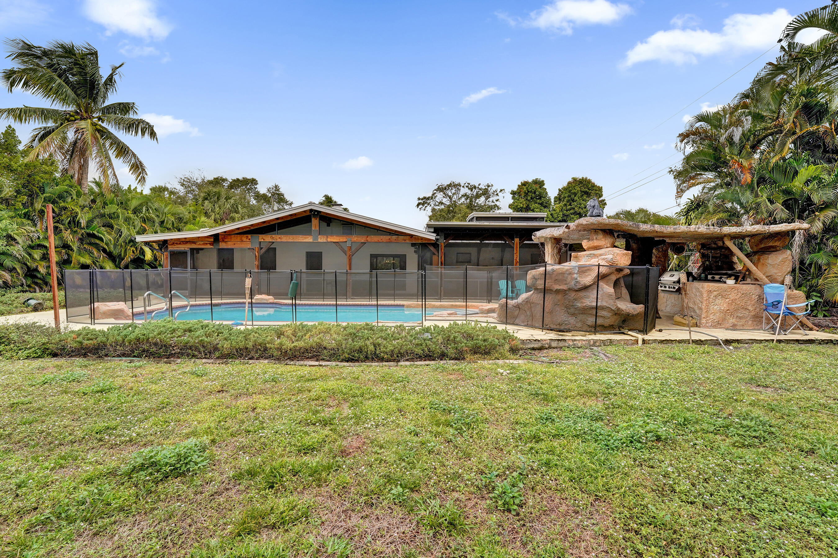 5612 Harding Street Hollywood, FL 33021 - Photo 44 of 52 a front view of a house with a garden