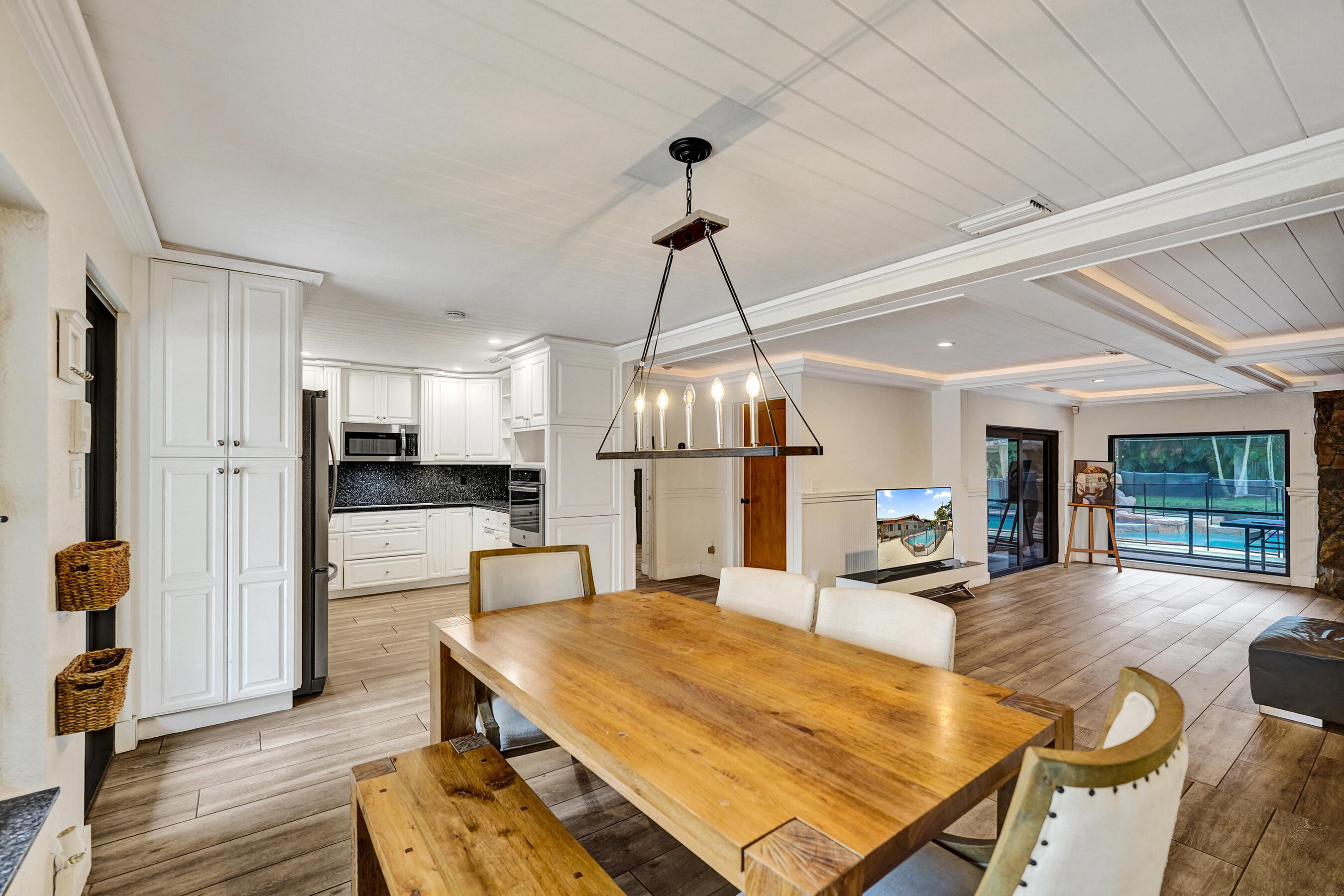 5612 Harding Street Hollywood, FL 33021 - Photo 50 of 52 a living room with dining table and wooden floor