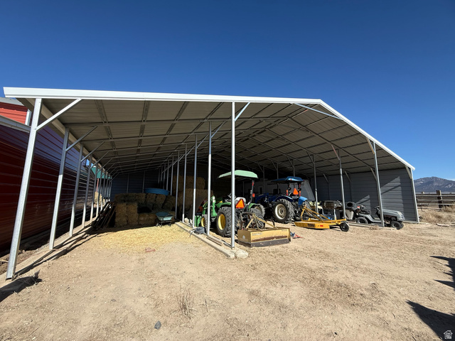 3550 North River Ln Road East Panguitch, UT 84759 - Photo 3 of 25 Expansive metal-framed carport featuring a corrugated metal roof and open sides