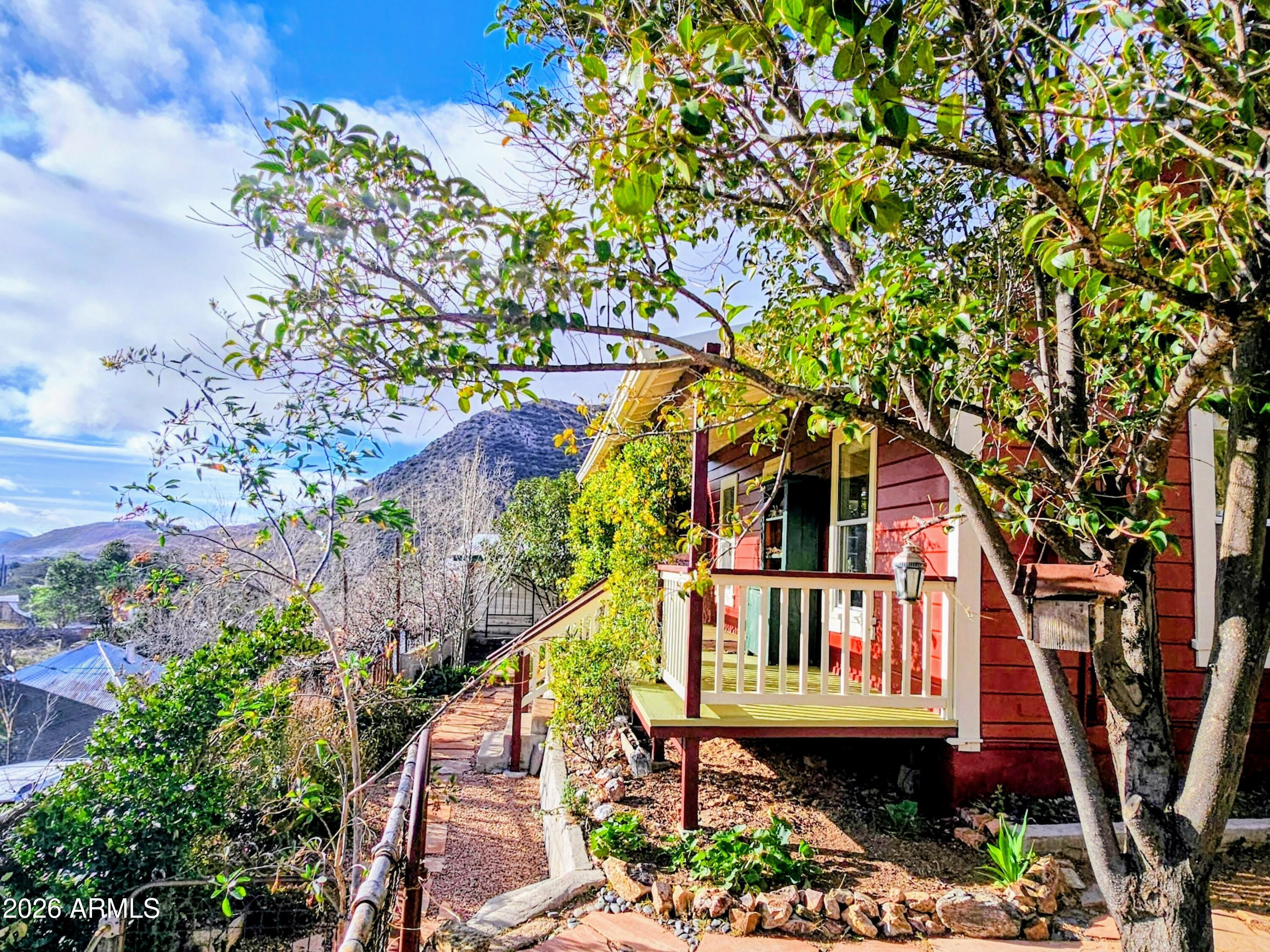 a view of a house with large trees
