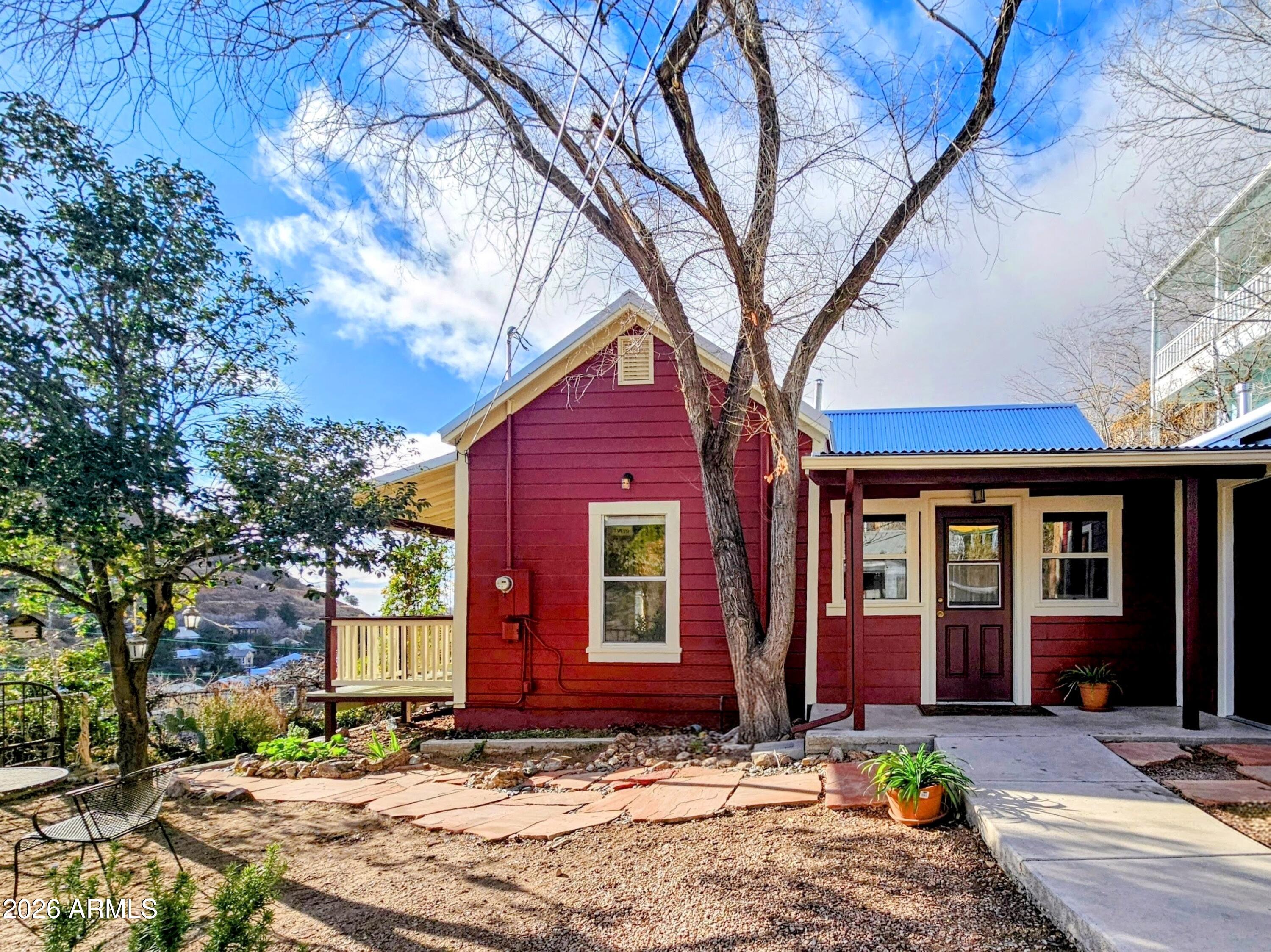 138 B Opera Drive Bisbee, AZ 85603 - Photo 2 of 34 a front view of a house with yard