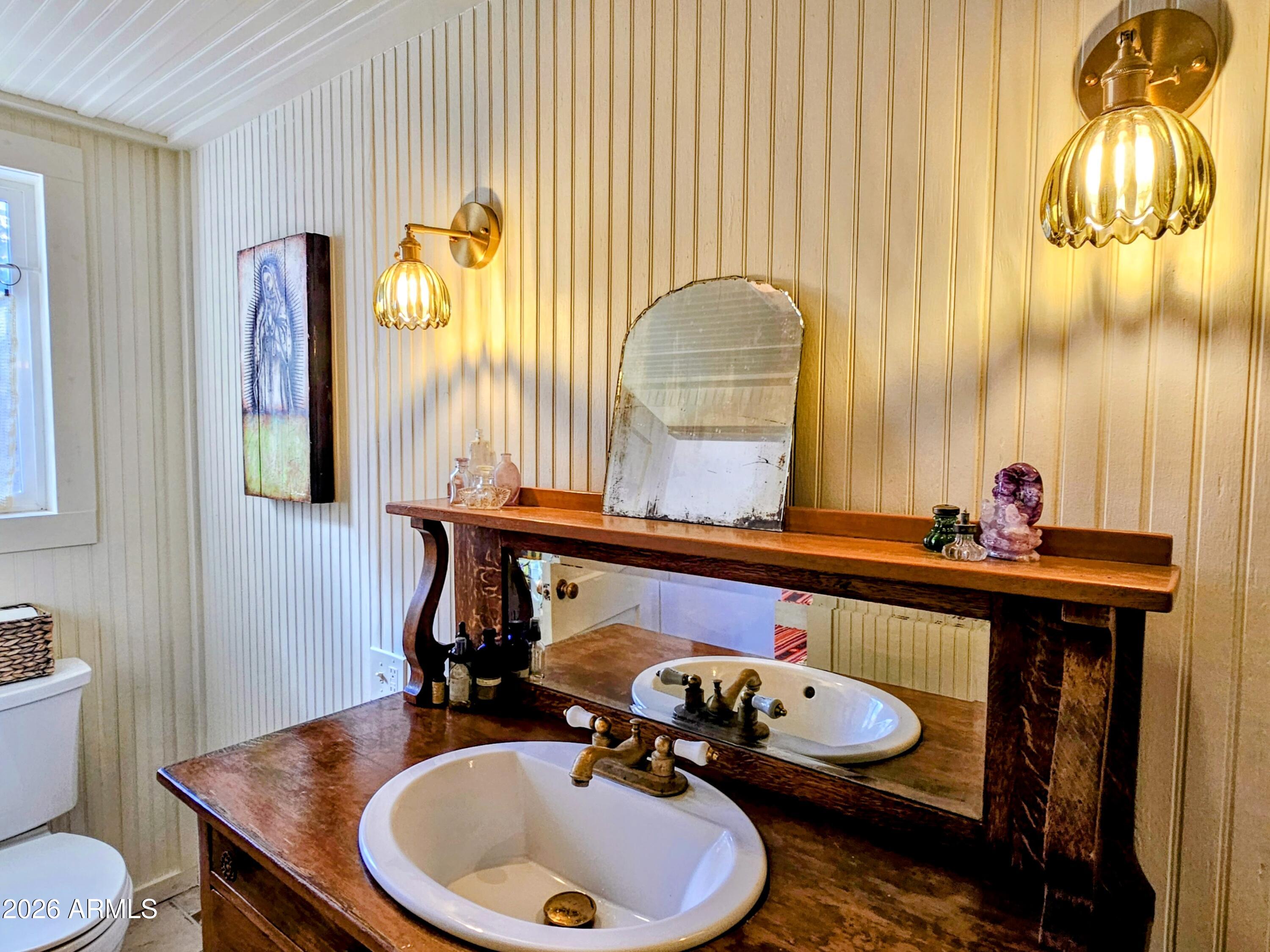 138 B Opera Drive Bisbee, AZ 85603 - Photo 22 of 34 a bathroom with a sink mirror and vanity
