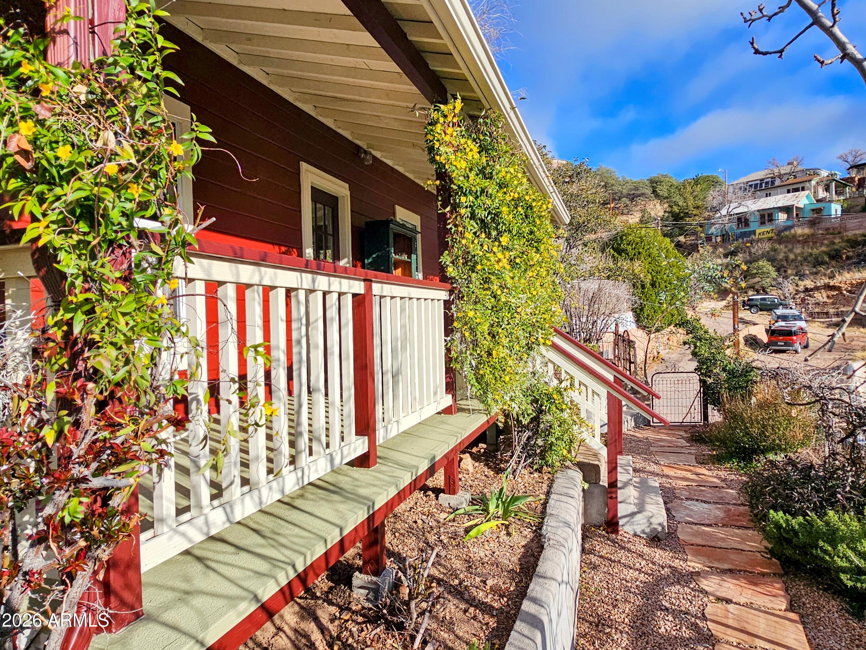 138 B Opera Drive Bisbee, AZ 85603 - Photo 26 of 34 a view of a house with wooden fence