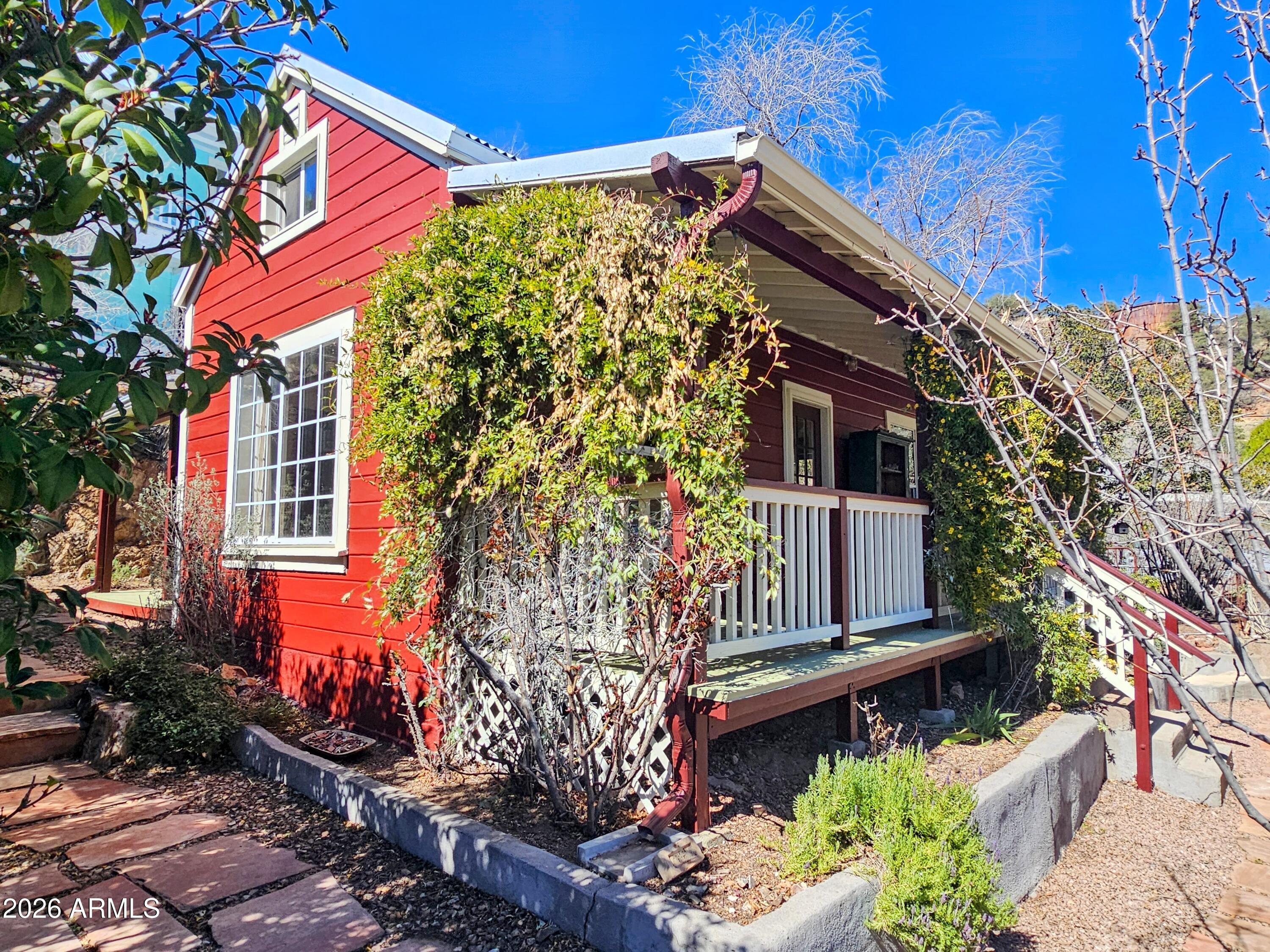 138 B Opera Drive Bisbee, AZ 85603 - Photo 27 of 34 a front view of a house with a yard