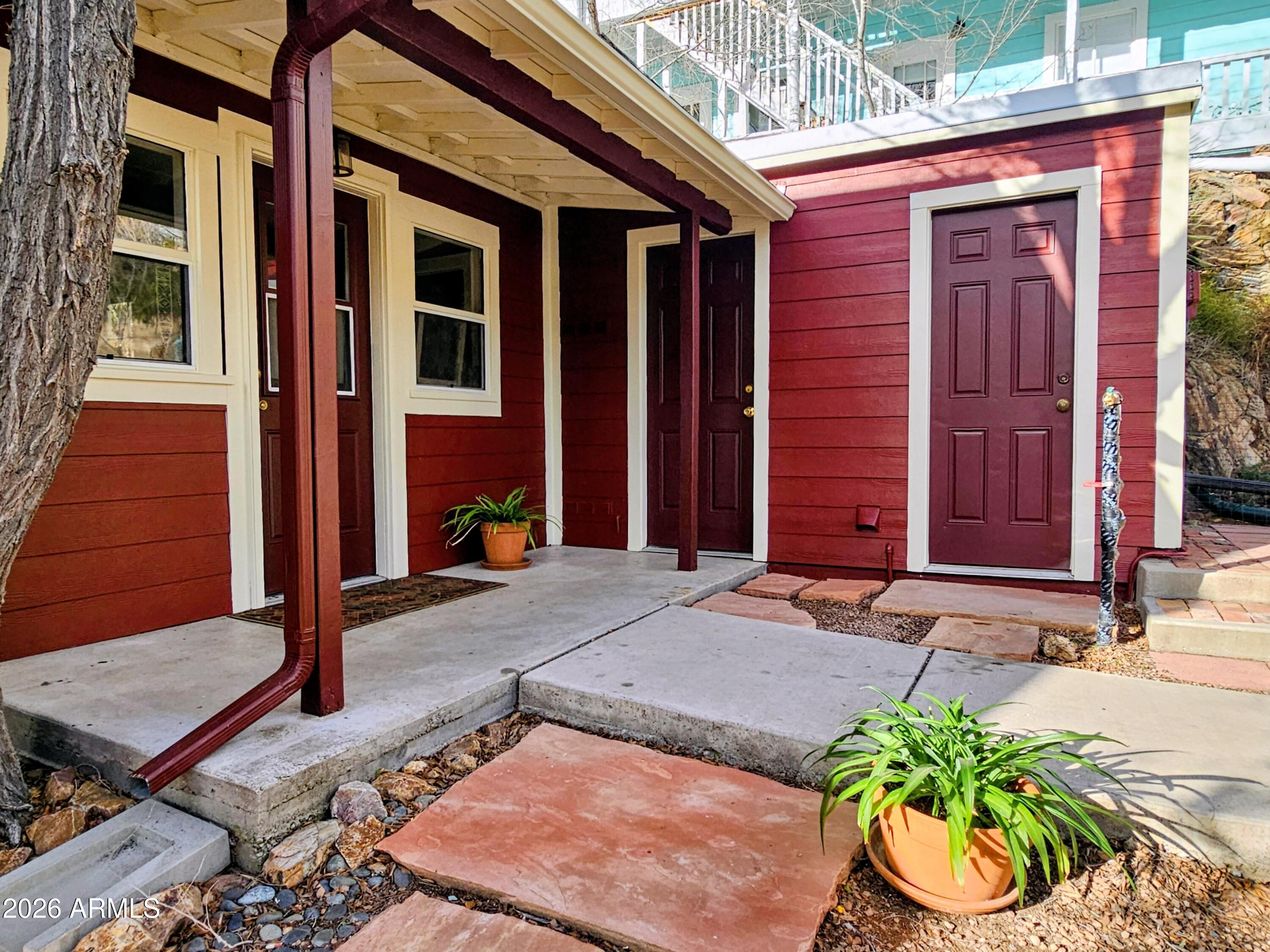 138 B Opera Drive Bisbee, AZ 85603 - Photo 31 of 34 a front view of a house with a yard