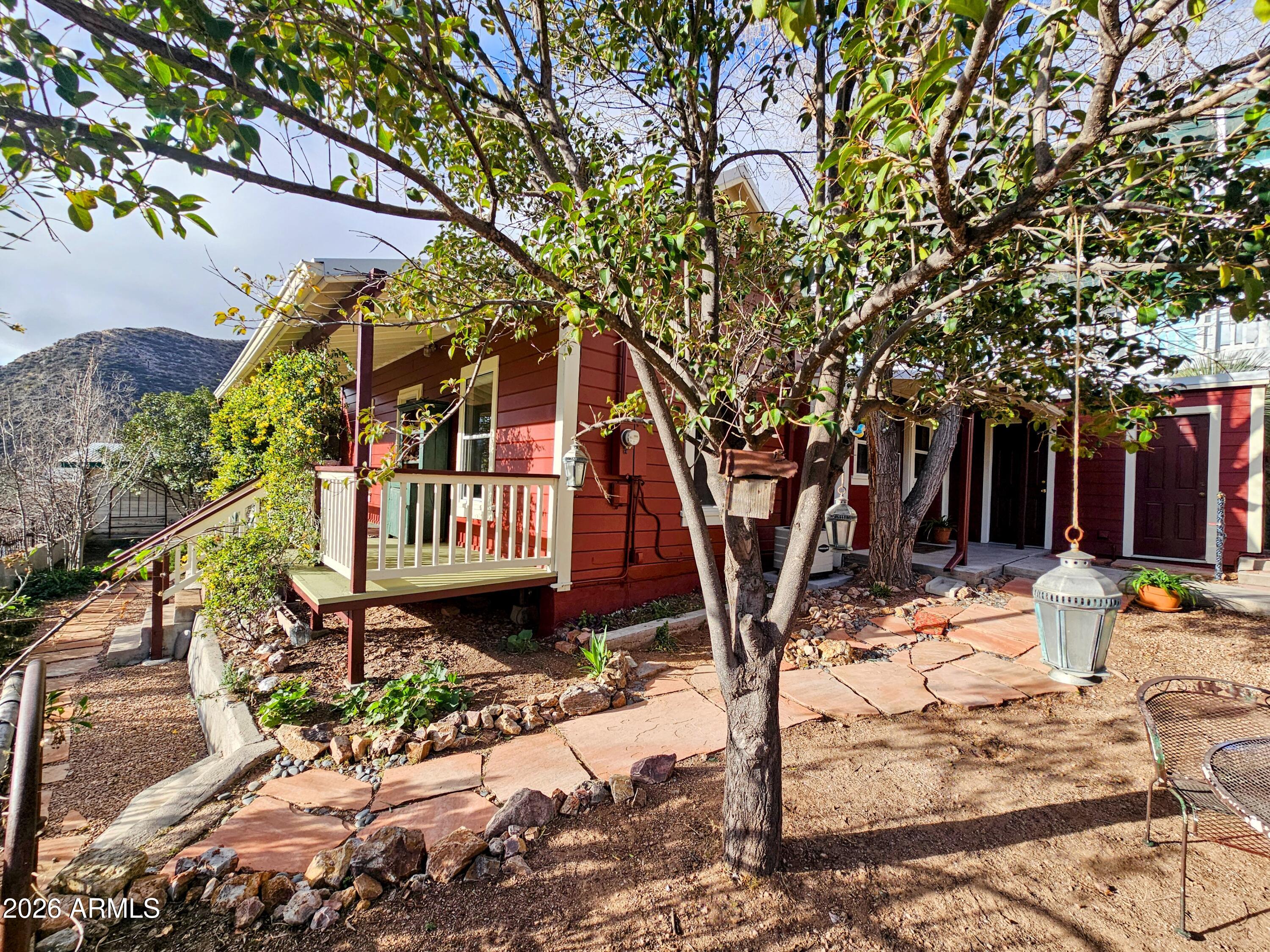 138 B Opera Drive Bisbee, AZ 85603 - Photo 32 of 34 a backyard of a house with table and chairs
