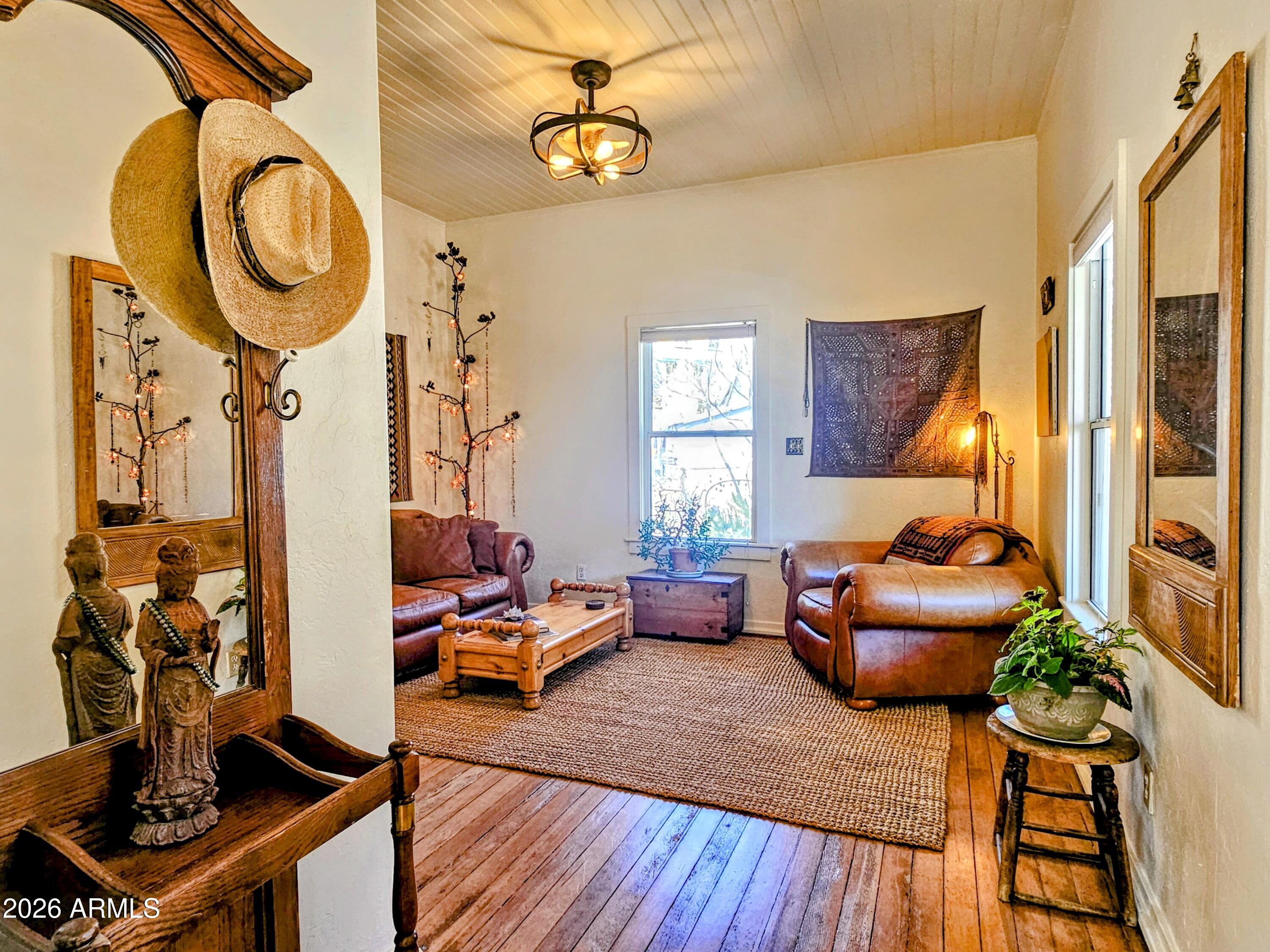 138 B Opera Drive Bisbee, AZ 85603 - Photo 6 of 34 a living room with furniture and a chandelier