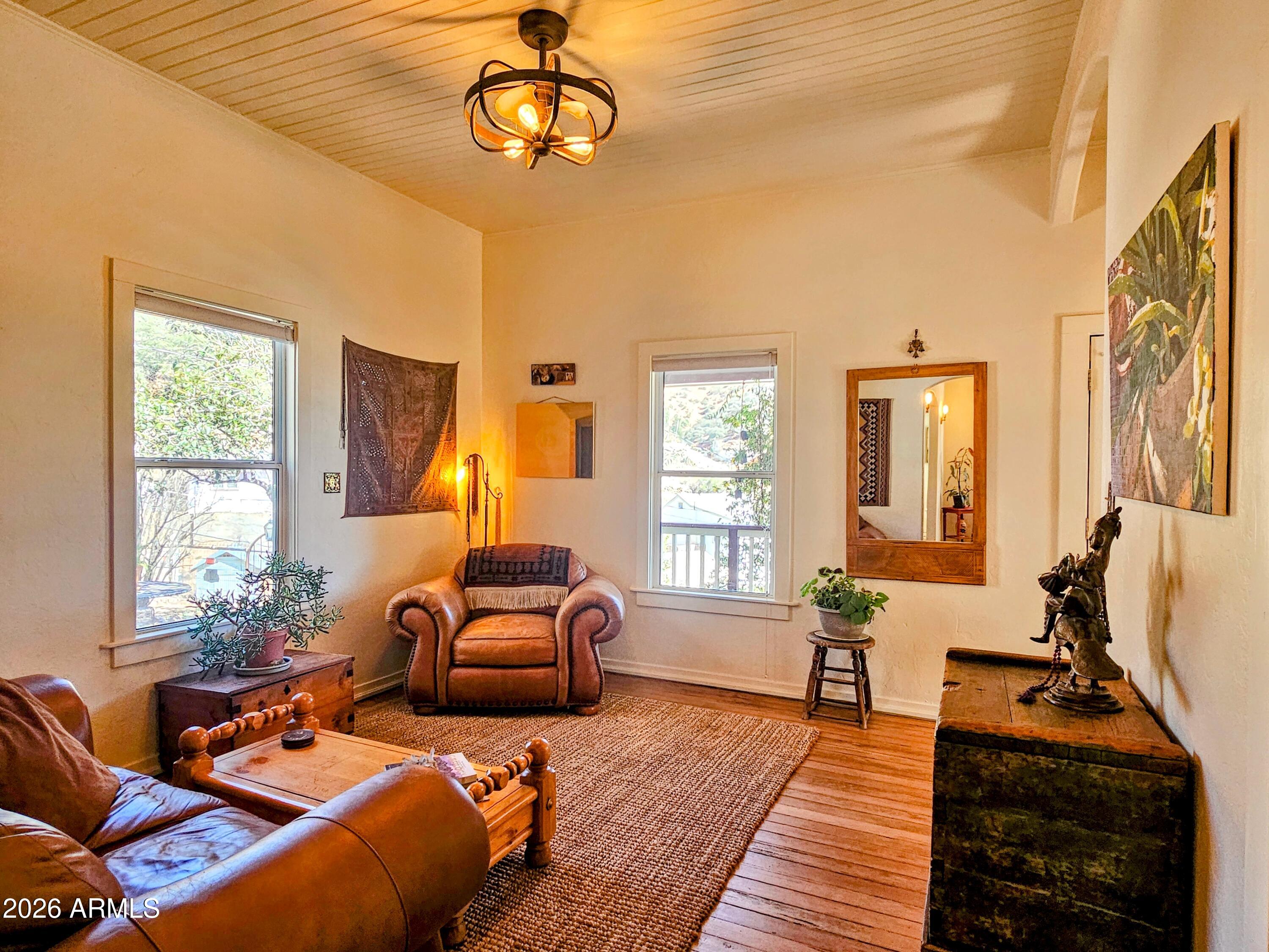 138 B Opera Drive Bisbee, AZ 85603 - Photo 10 of 34 a living room with furniture fireplace and a large window